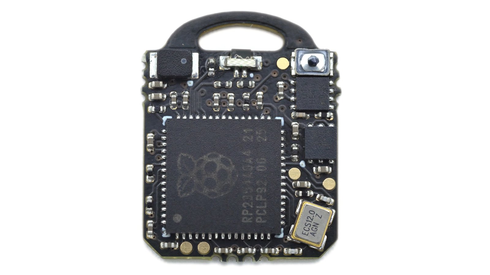 Component side of the black Romu PCB showing its RP2354A microcontroller and small onboard controls