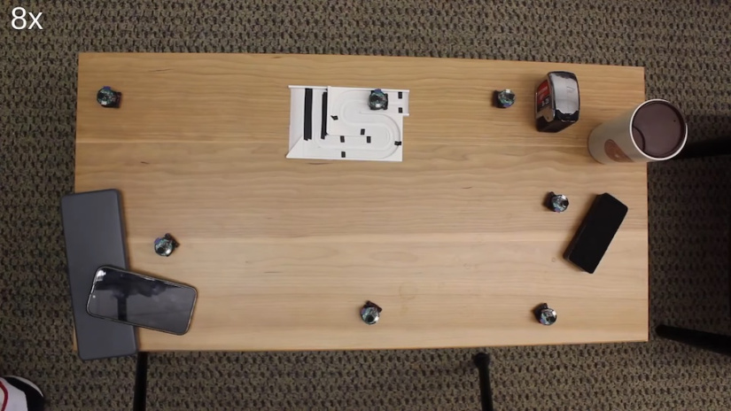 By maintaining a significant distance between each robotic unit, the system can effectively create specific audio zones and mute undesired sounds