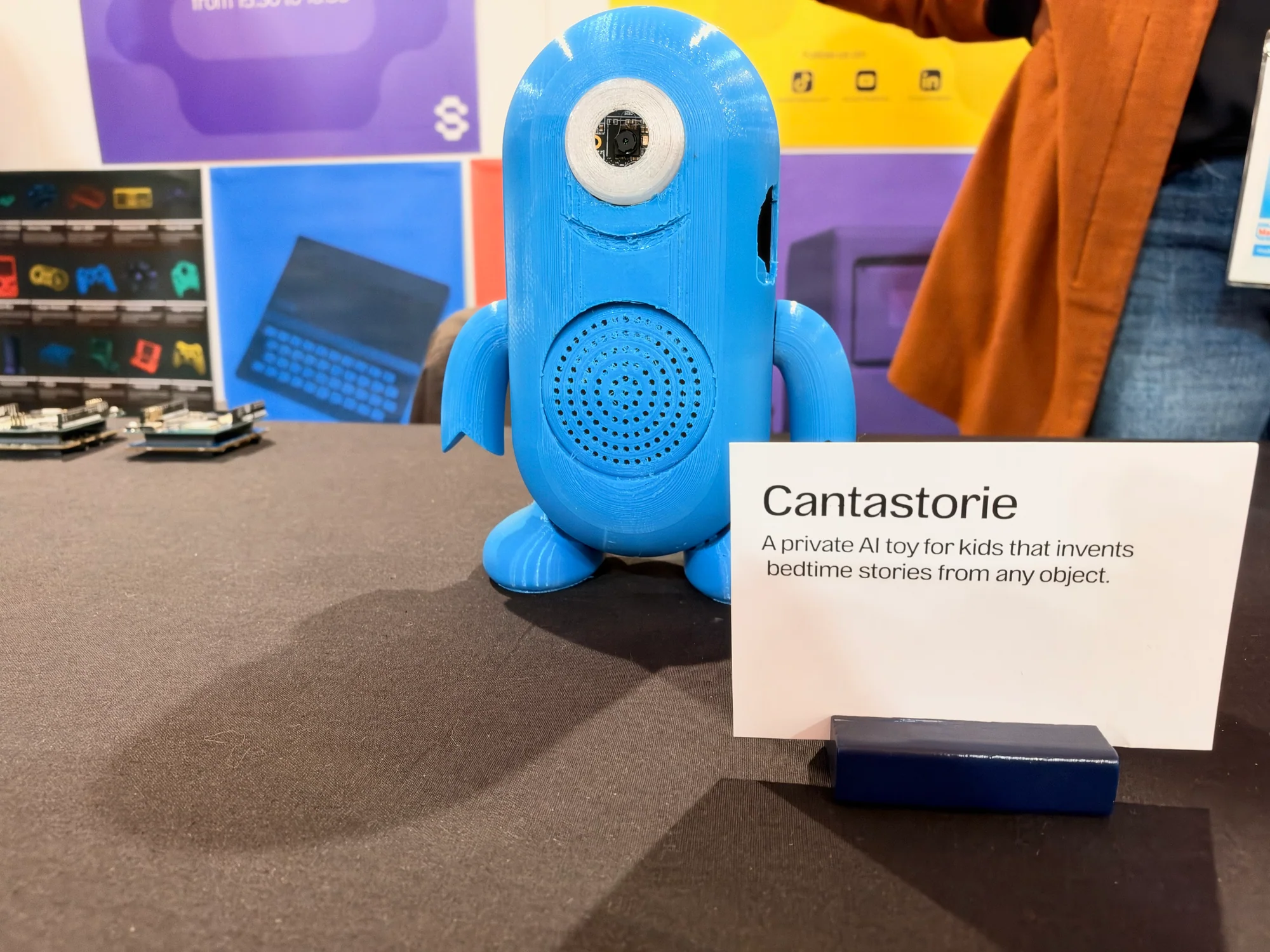 Blue Cantastorie storytelling toy prototype with an eye and speaker grille
