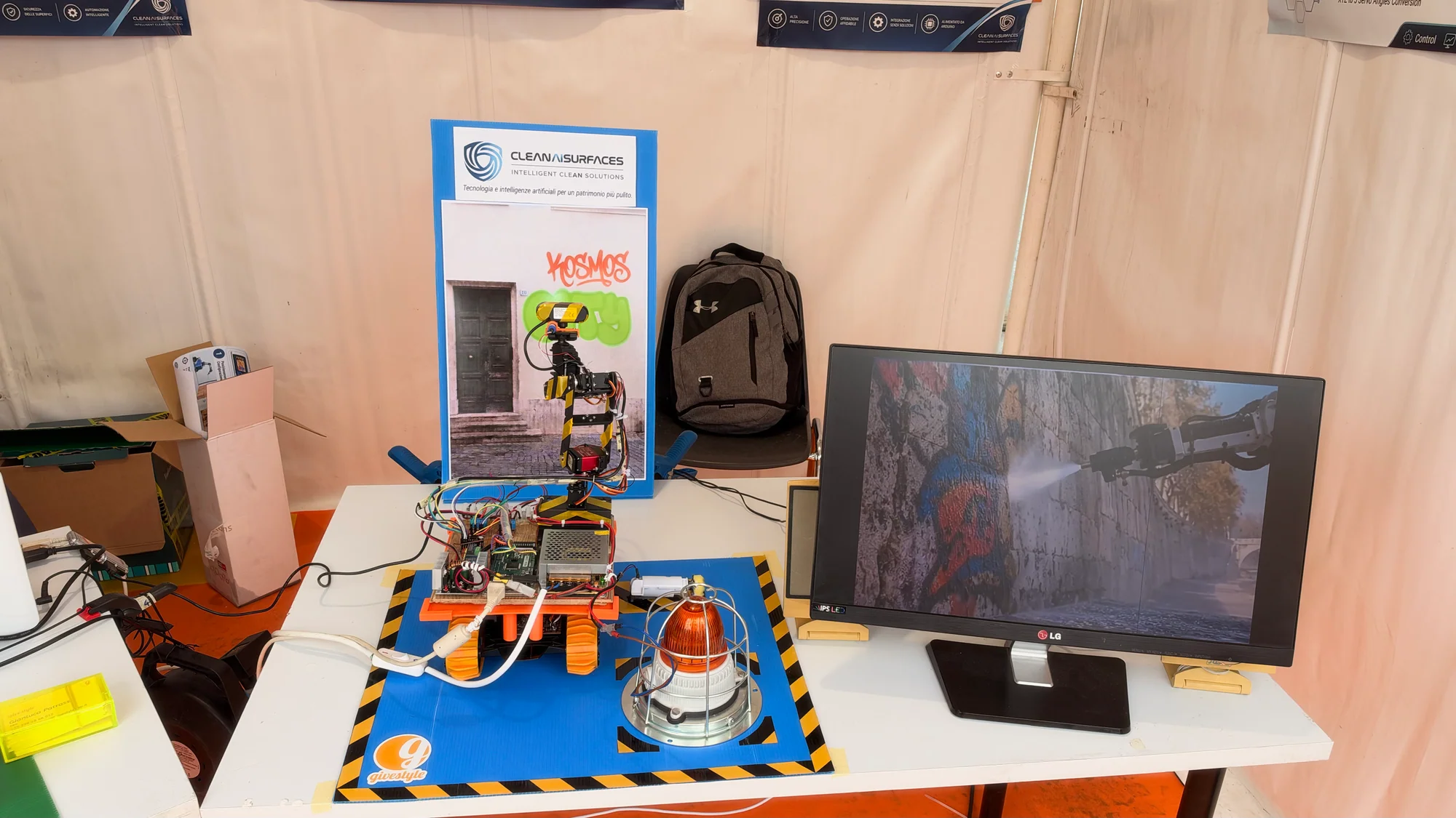 Clean AI Surfaces prototype robot and computer display