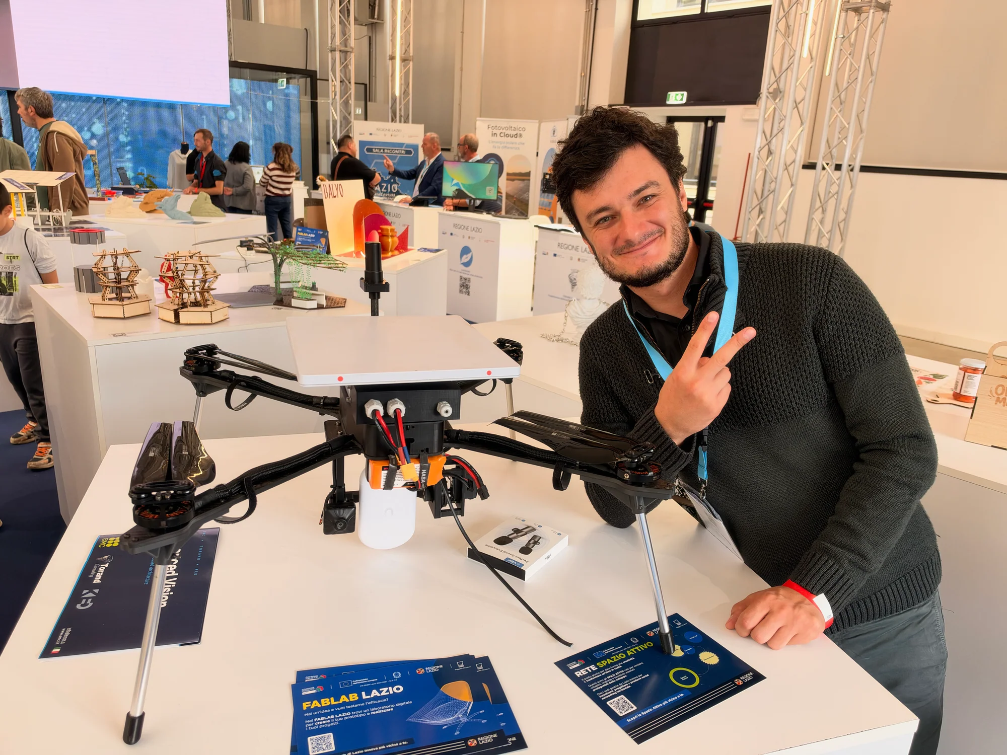 Multirotor drone displayed with FabLab Lazio project information