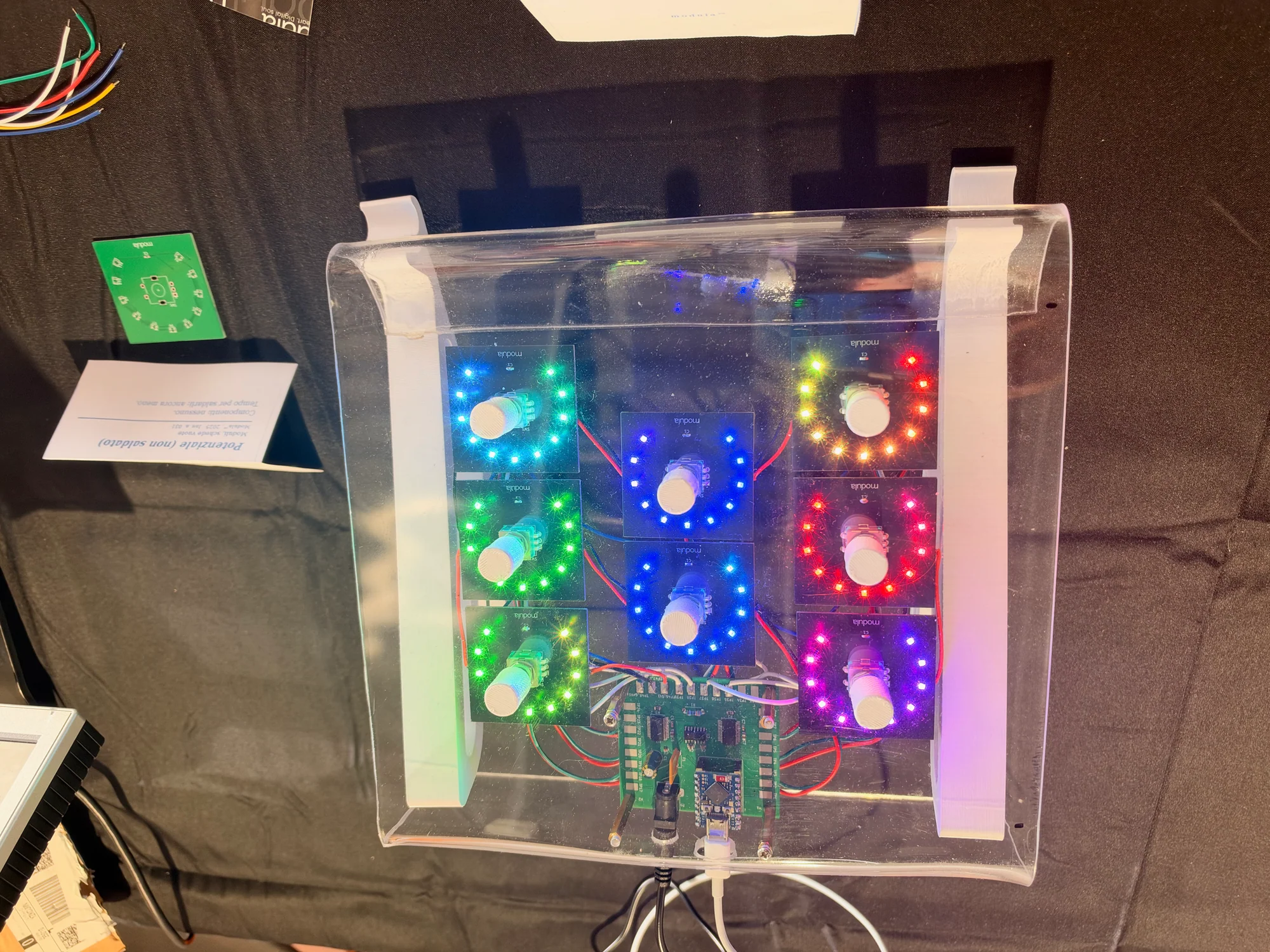 Modula electronic music controller with illuminated rotary controls in a clear enclosure