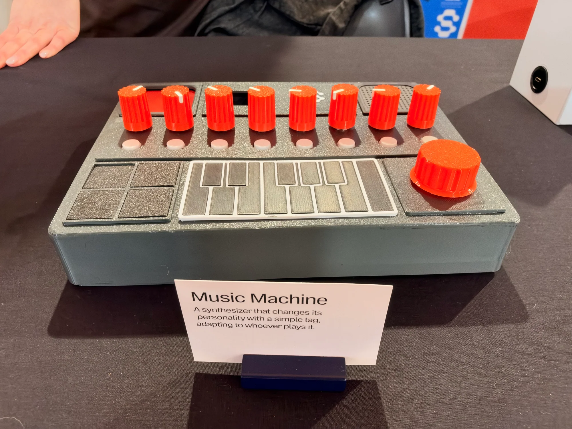 Music Machine synthesizer prototype with orange knobs, keyboard and pads