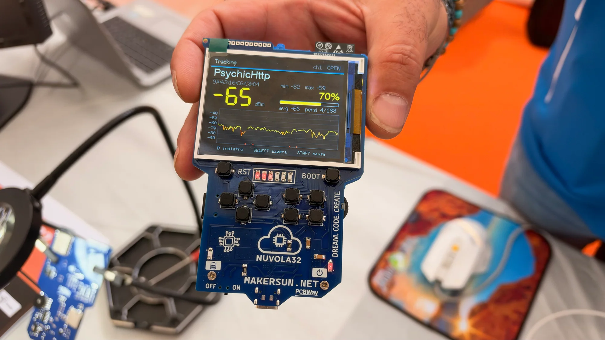 Nuvola32 handheld development board showing graphs and numerical readings