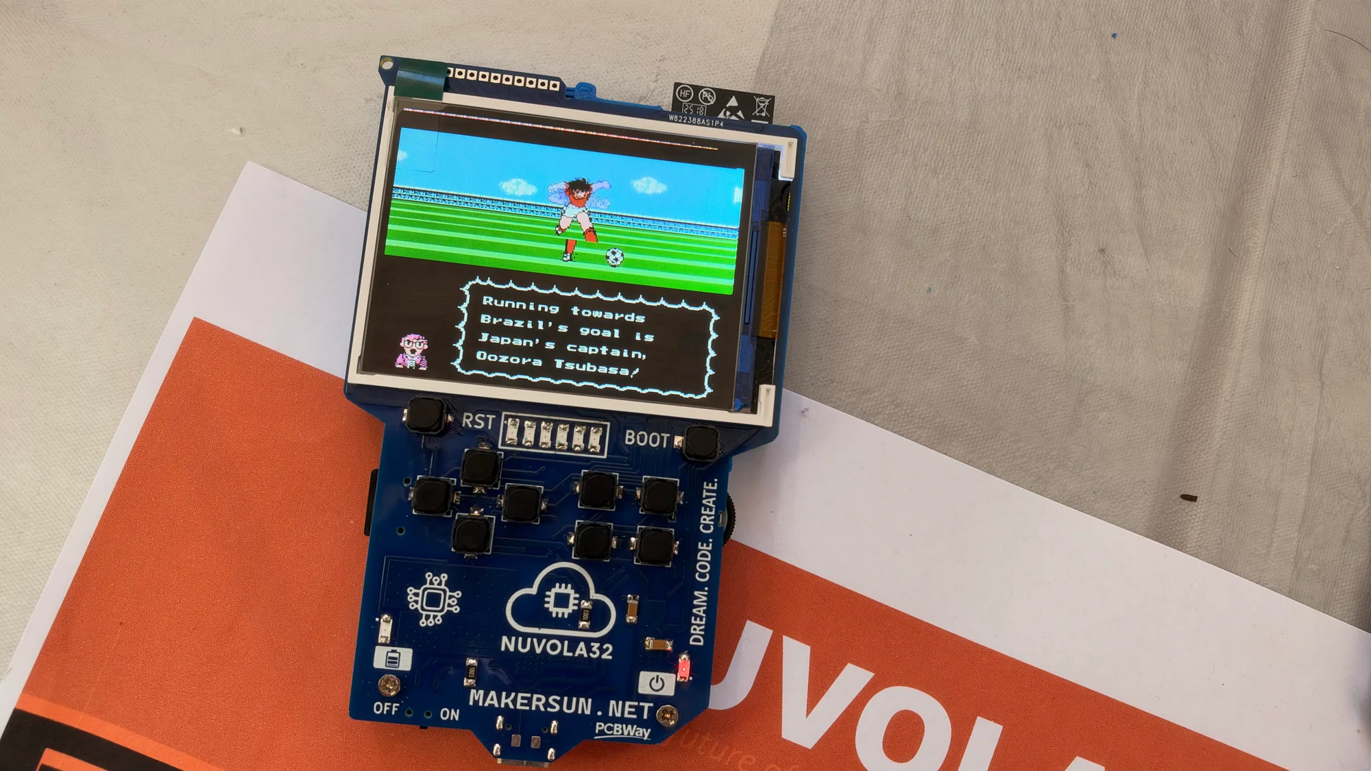 Nuvola32 development board displaying a retro-style game
