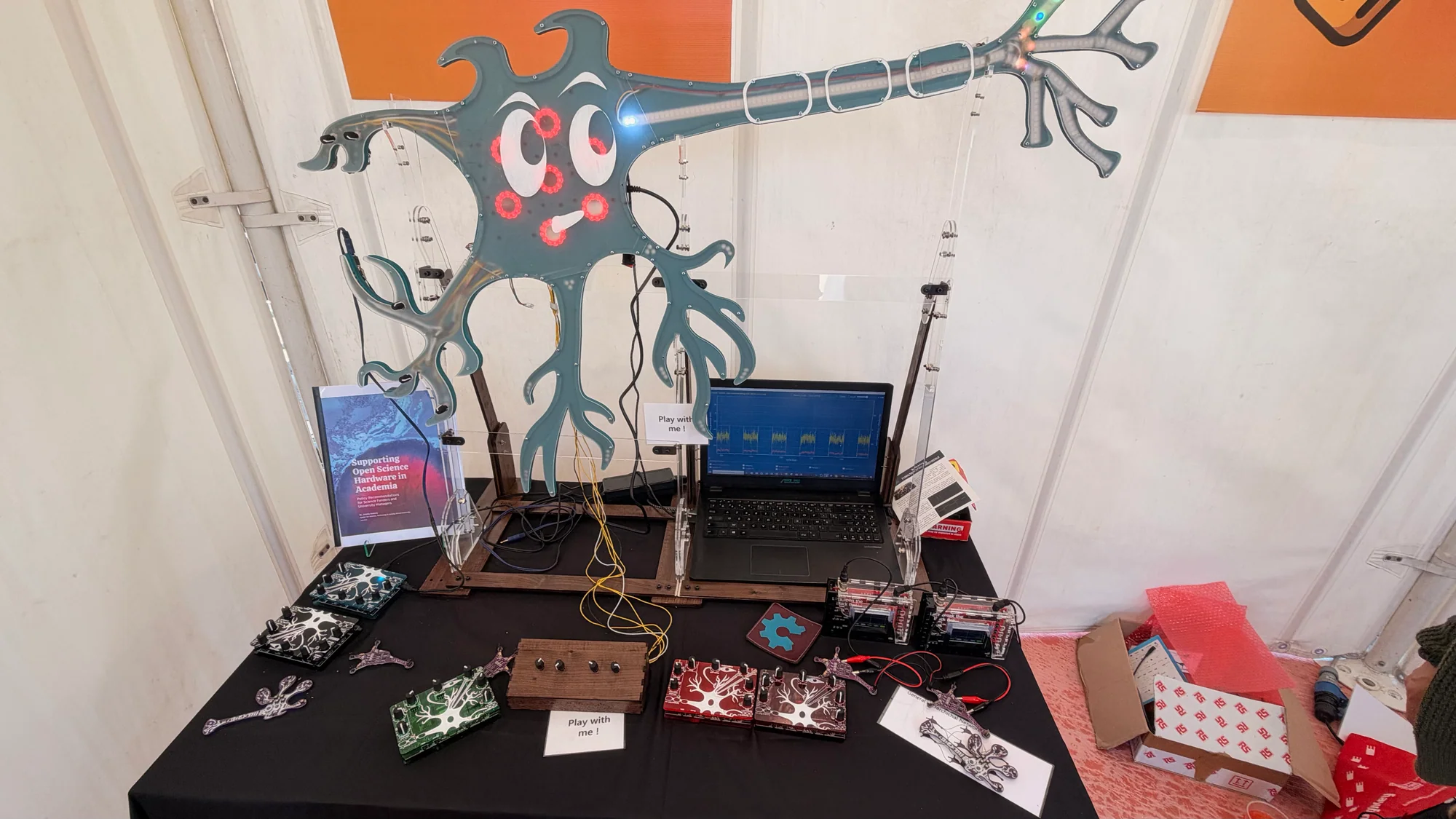 Open-science demonstration with an illuminated neuron model and electronic teaching boards