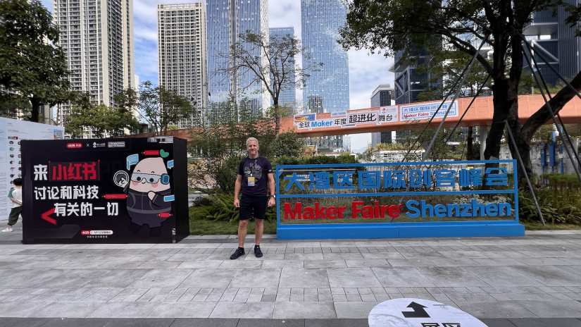 Richard Elliot standing in front of the entrance to Maker Faire Shenzhen 2025
