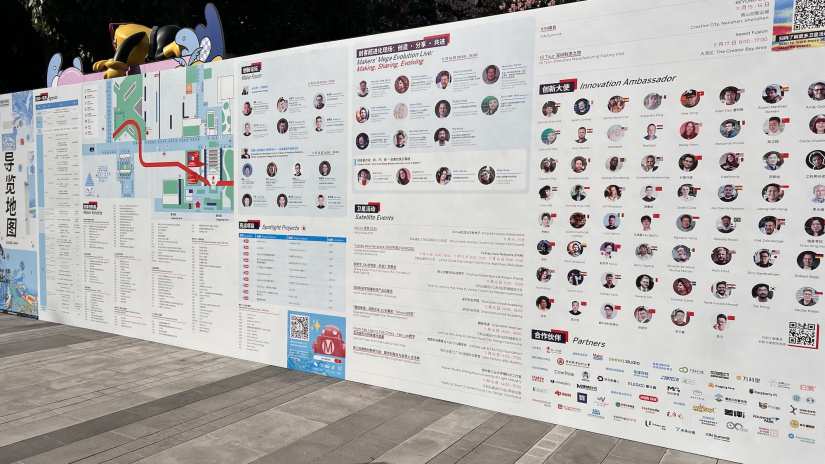 Large billboard showing information about Maker Faire, including the innovation ambassadors