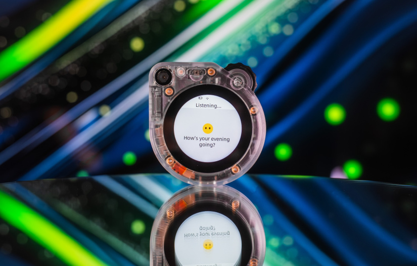  SenseCAP Watcher W1-A on a blue and green background