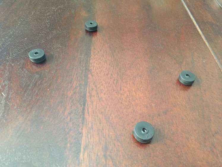 5. Prepare Rubber Feet - insert hex nuts into bottoms of Rubber Feet