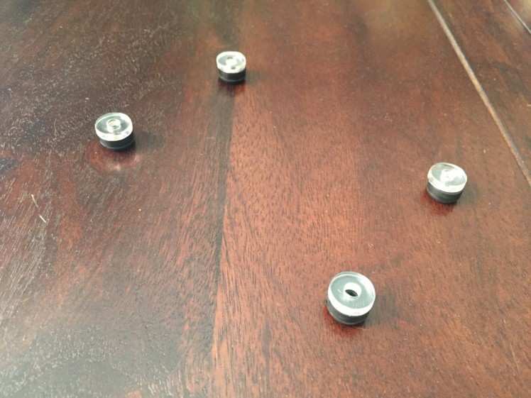 6. Place Washers on top of Rubber Feet